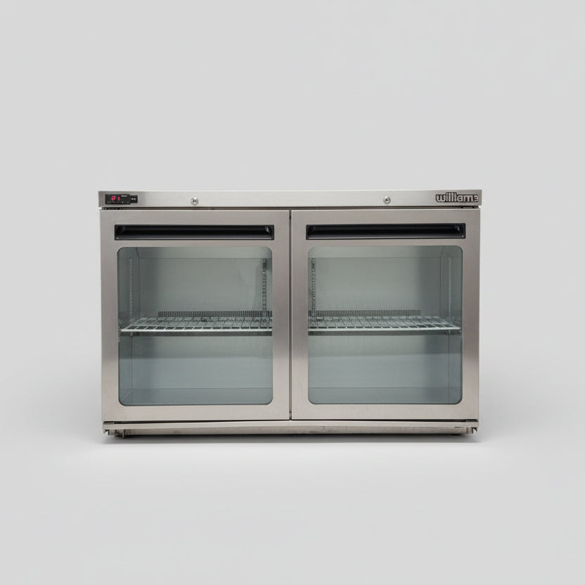 Stainless steel refrigerator with glass doors on a white background