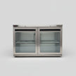 Stainless steel refrigerator with glass doors on a white background